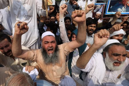 People chant slogans during a rally expressing solidarity with the people of Kashmir, in Peshawar