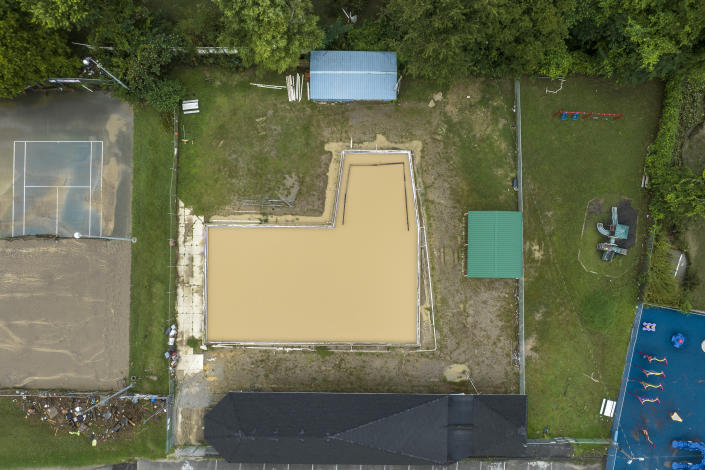 The Whitesburg Community Pool is filled with flood water in Whitesburg, Ky., on Friday, July 29, 2022. (Ryan C. Hermens/Lexington Herald-Leader via AP)