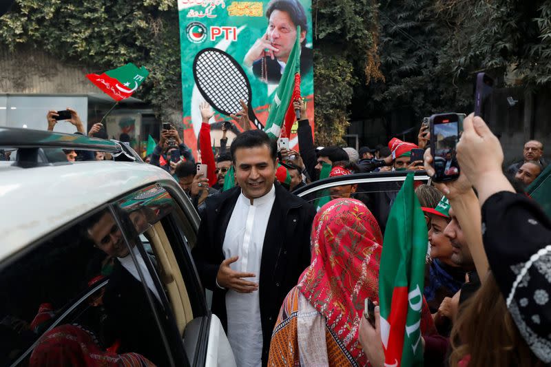 Supporters of former Prime Minister Imran Khan gather during a rally ahead of the general elections in Lahore