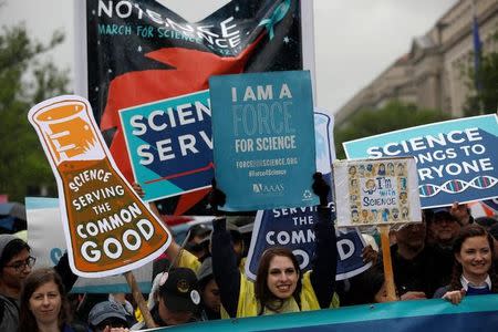 Demonstrators march to the U.S. Capitol during the March for Science in Washington, U.S., April 22, 2017. REUTERS/Aaron P. Bernstein