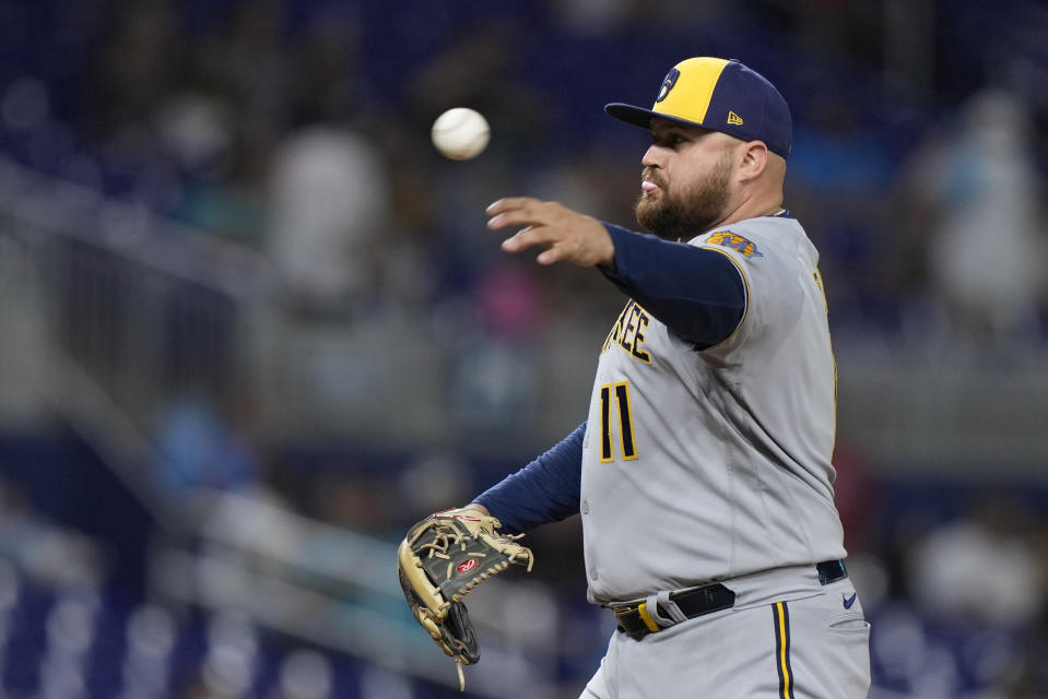 Milwaukee Brewers first baseman Rowdy Tellez pitches during the ninth inning of a baseball game against the Miami Marlins, Friday, Sept. 22, 2023, in Miami. (AP Photo/Wilfredo Lee)