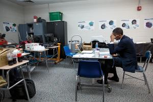 Then-President Obama sits in a classroom at Newtown High School, going over his remarks before the Sandy Hook memorial service. <em>December 16, 2012</em>