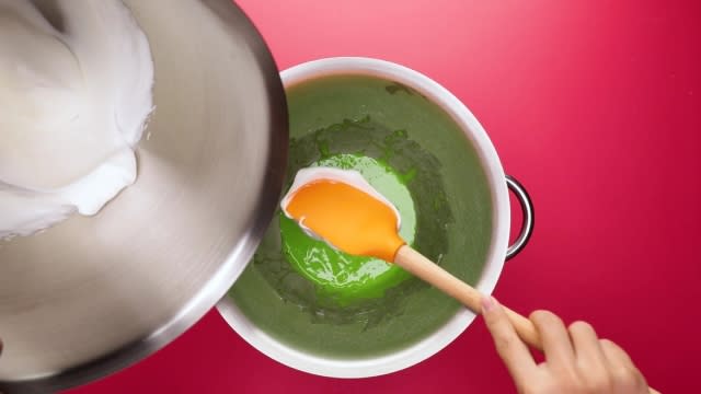 Adding meringue to pandan egg yolk mixture