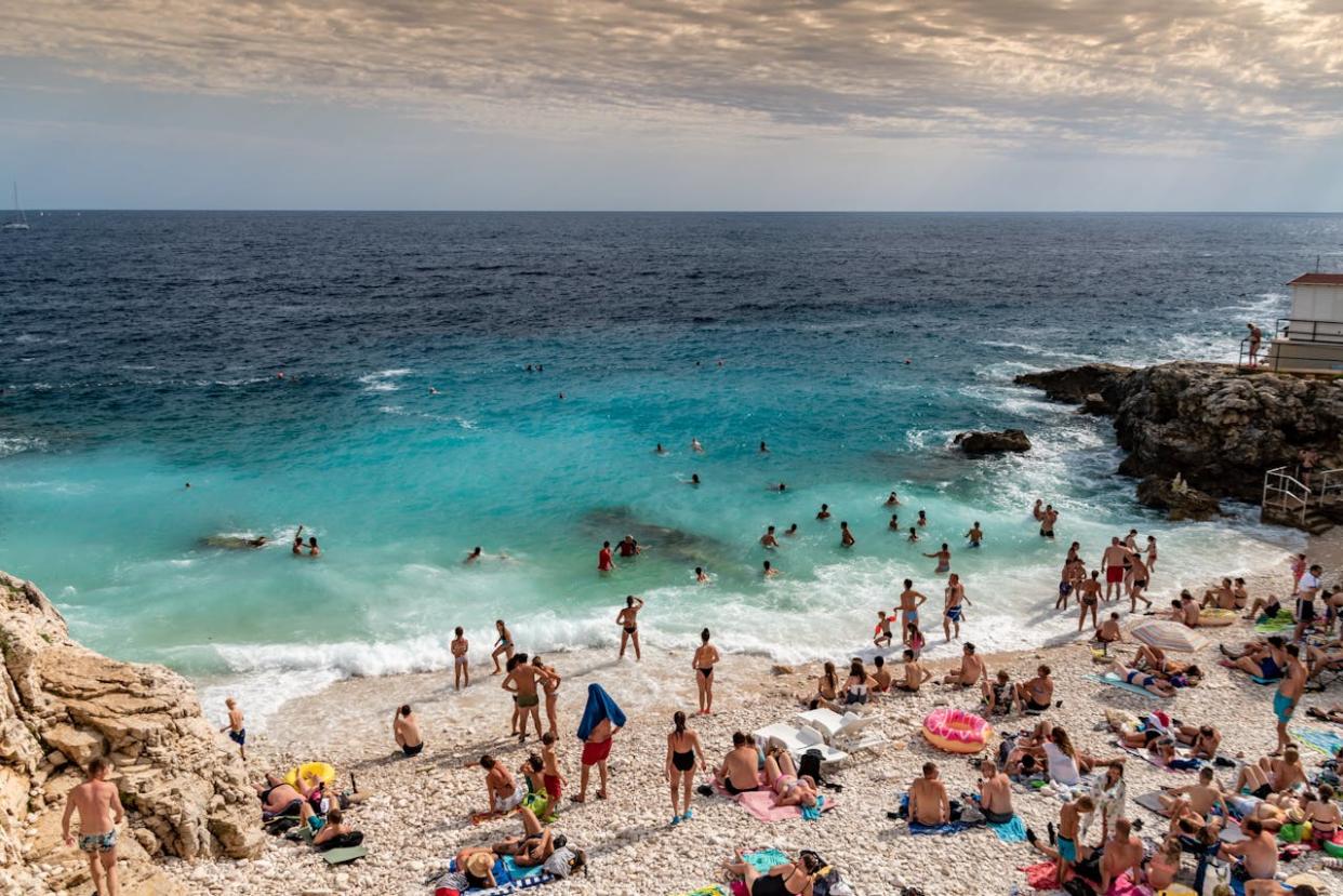 Crowd of people on a beach during a sunny day