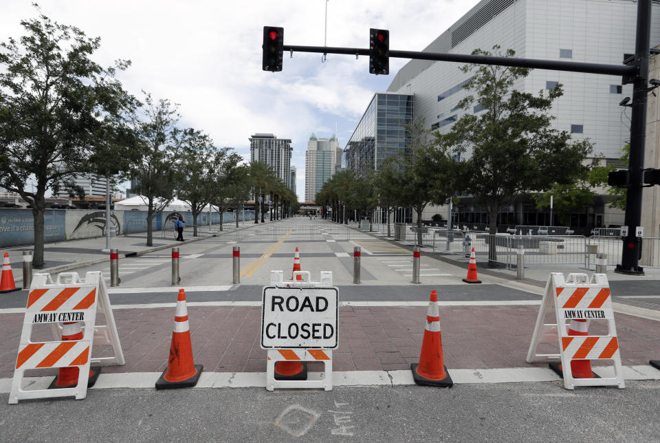 Road closures are seen around the Amway Center, right, on Monday, June 17, 2019 the site of a Tuesday night rally for President Donald Trump, in Orlando, Fla. (AP Photo/John Raoux)