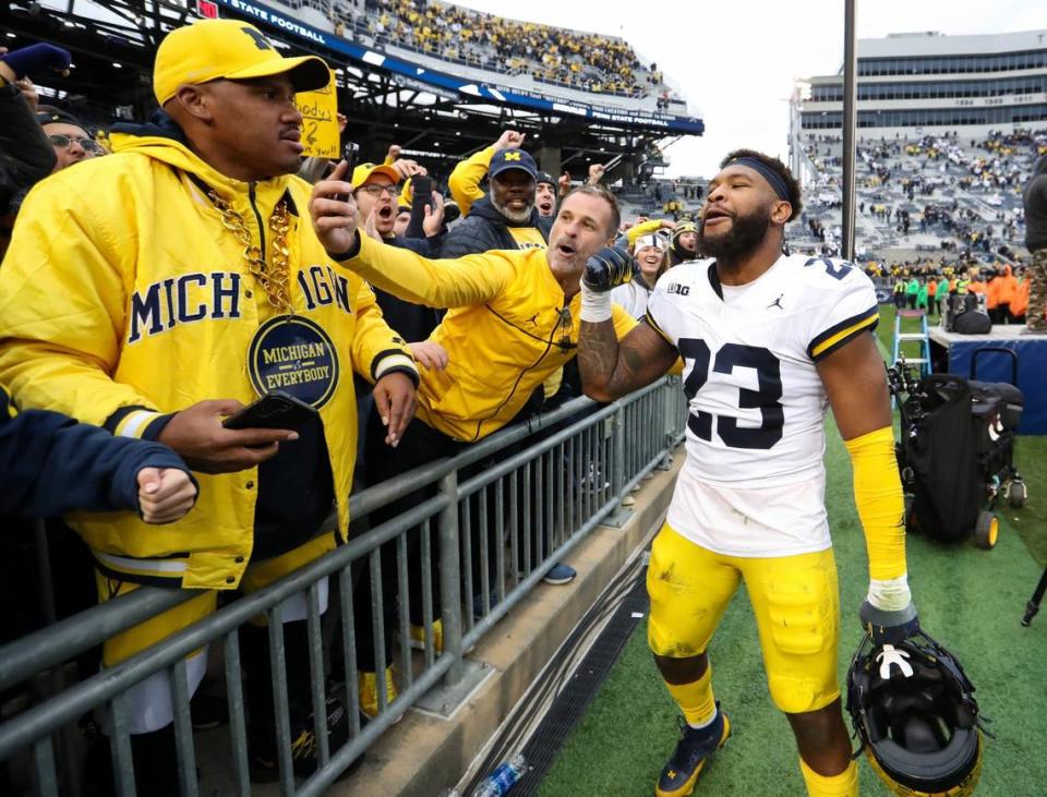 Nov 11, 2023; University Park, Pennsylvania, USA; Michigan Wolverines linebacker Michael Barrett (23) interacts with fans following a game against the Penn State Nittany Lions at Beaver Stadium. Michigan won 24-15. Mandatory Credit: Matthew O’Haren-USA TODAY Sports