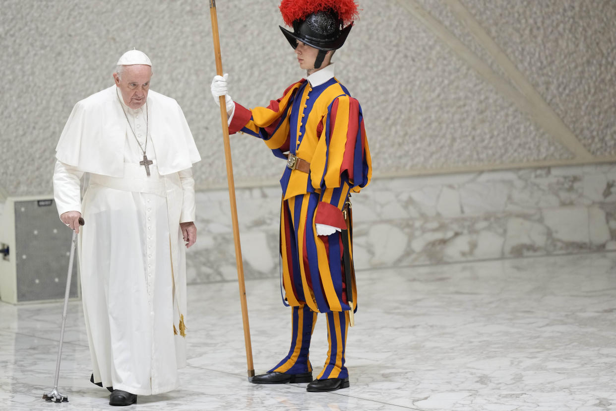 Pope Francis arrives in the Paul VI hall on the occasion of the weekly general audience at the Vatican, Wednesday, Aug. 10, 2022. (AP Photo/Andrew Medichini)