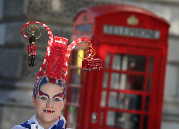Josie Todd wears a hair sculpture depicting a London phone box on August 9, 2012 in London, England. Created by Catalonian performance artists Osadia, these sculpted hair pieces are a tribute the success of Team GB in the London 2012 Olympics and will be touring London as part of Showtime a large London outdoor arts festival. (Photo by Peter Macdiarmid/Getty Images)