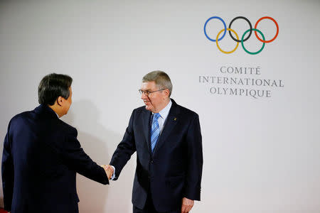 International Olympic Committee (IOC) President Thomas Bach welcomes Jong-Hwan Do, Minister of Culture, Sports and Tourism of the Republic of Korea (ROK) at the IOC headquarters in Lausanne, Switzerland, January 20, 2018. REUTERS/Pierre Albouy