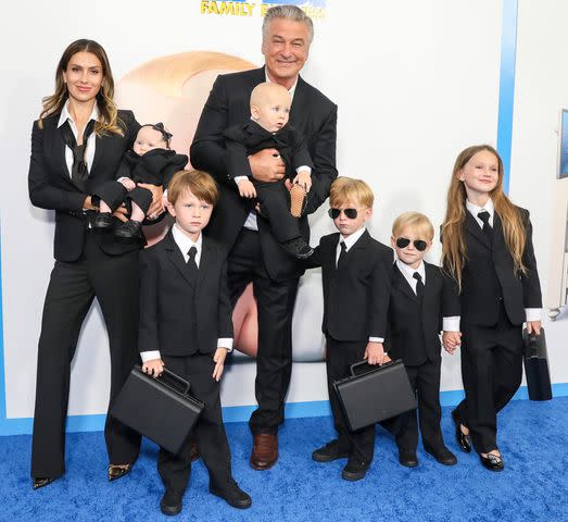 Monica Schipper/Getty Images Alec and Hilaria Baldwin pose with six of their seven children.