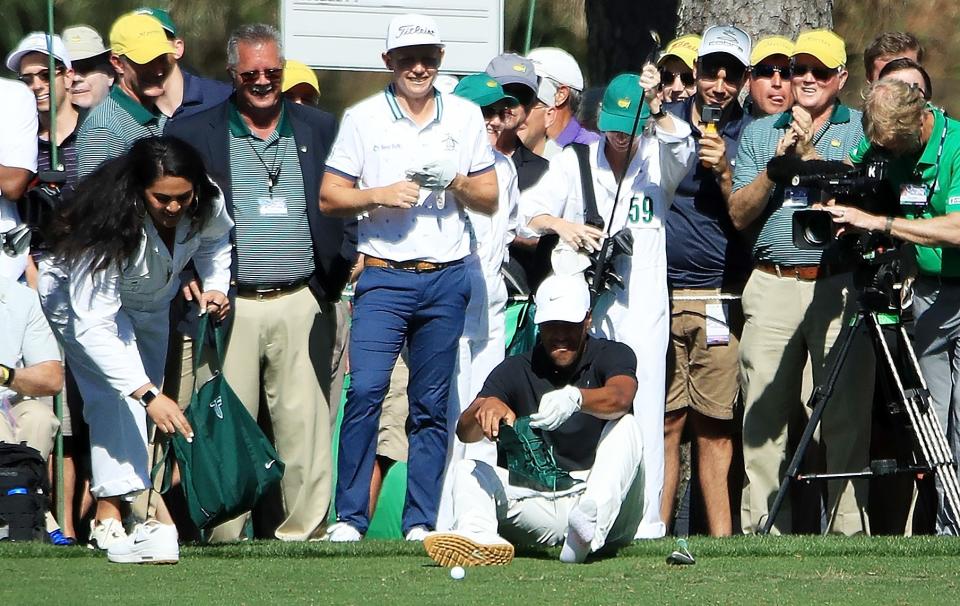 AUGUSTA, GEORGIA - APRIL 10: Tony Finau of the United States changes his footwear during the Par 3 Contest prior to the Masters at Augusta National Golf Club on April 10, 2019 in Augusta, Georgia. (Photo by Andrew Redington/Getty Images)