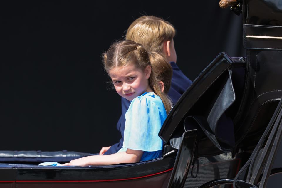 Princess Charlotte of Cambridge rides in a carriage during the Trooping the Colour parade.