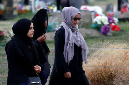 Relatives and other people arrive to attend the burial ceremony of the victims of the mosque attacks, at the Memorial Park Cemetery in Christchurch, New Zealand March 21, 2019. REUTERS/Jorge Silva