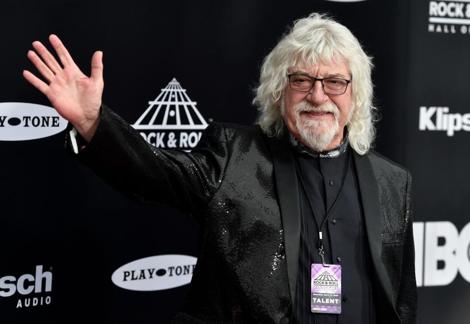 Graeme Edge, drummer for The Moody Blues and long time Bradenton resident, waves on the red carpet before the Rock and Roll Hall of Fame induction ceremony April 14, 2018, in Cleveland. Edge, a drummer and co-founder of the band, has died. He was 80.