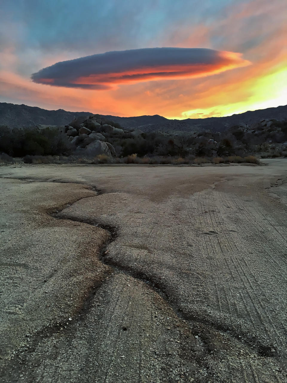 Symmetrical cloud formation over desert landscape, Anza Borrego State Park, California.