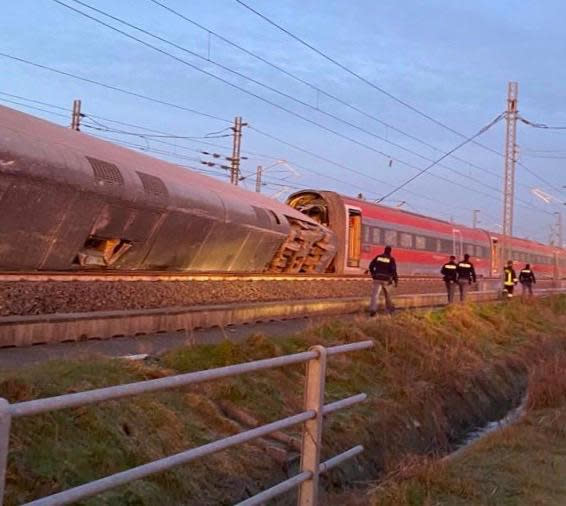 Police is seen at the scene where a high speed train travelling from Milan to Bologna derailed, in Lodi