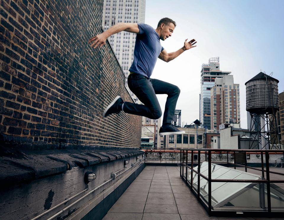 ryan reynolds leaping from a building