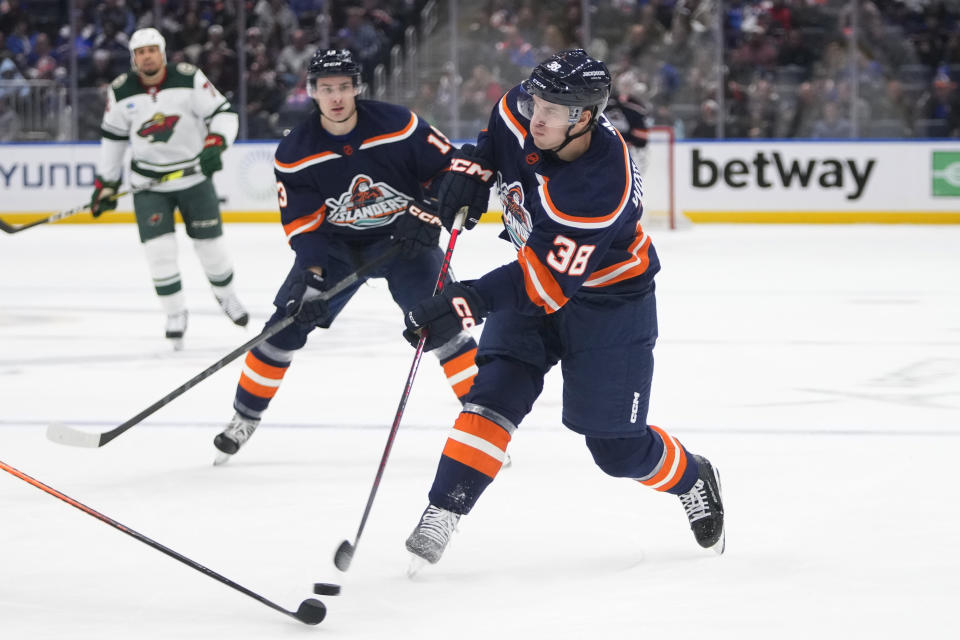 New York Islanders' Parker Wotherspoon (38) shoots the puck during the second period of the team's NHL hockey game against the Minnesota Wild on Thursday, Jan. 12, 2023, in Elmont, N.Y. (AP Photo/Frank Franklin II)