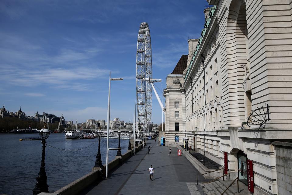 An almost empty pavement is pictured on the South Bank, by the River Thames, with the landmark the London Eye beyond, in central London on April 7, 2020, as life in Britain continues during the nationwide lockdown to combat the novel coronavirus pandemic. - British Prime Minister Boris Johnson spent the night in intensive care after being admitted with a deteriorating case of coronavirus, prompting serious concerns on Tuesday about his health and the government's response to a still-escalating outbreak. (Photo by ISABEL INFANTES / AFP) (Photo by ISABEL INFANTES/AFP via Getty Images)