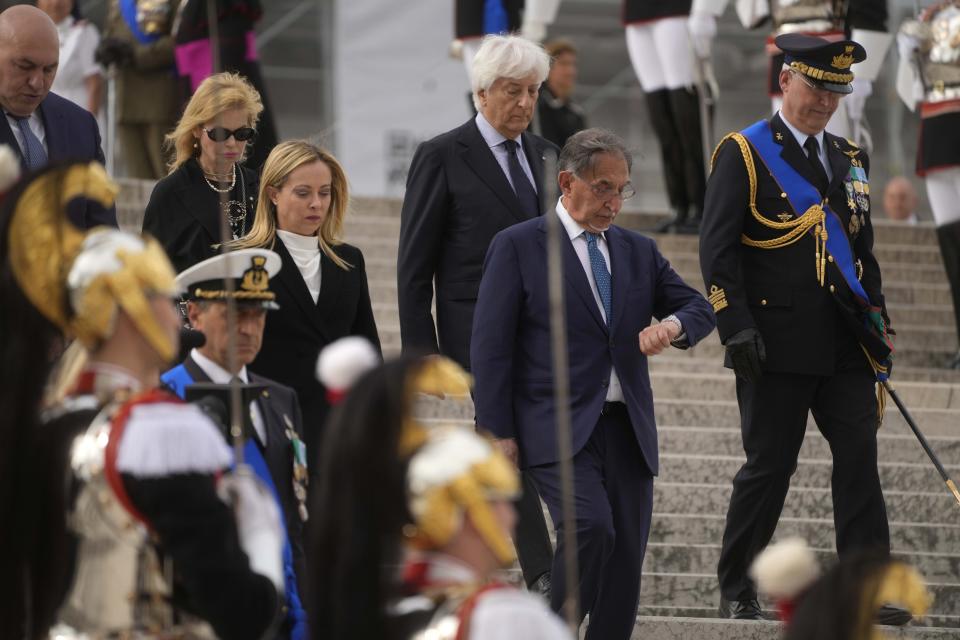 Italian Senate President Ignazio La Russa, right, and Italian Premier Giorgia Meloni attend a ceremony to mark Italy's Liberation day at the unknown soldier monument during, in Rome, Tuesday, April 25, 2023. The anniversary marks the day in 1945 when the Italian resistance movement proclaimed an insurgency as the Allies were pushing German forces out of the peninsula. (AP Photo/Gregorio Borgia)