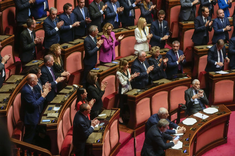 Italian senators applaud Holocaust survivor, Senator Liliana Segre as she chairs the opening session of the Italian Senate of the newly elected parliament, Thursday, Oct. 13, 2022. Italy voted on Sept. 25 to elect a new parliament. (AP Photo/Gregorio Borgia)