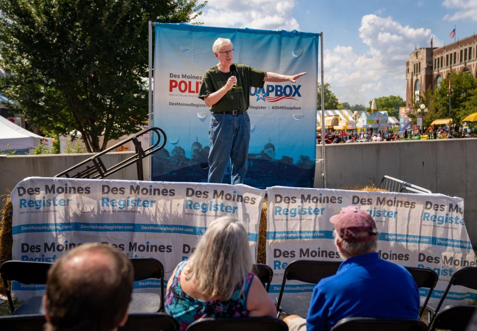 Iowa attorney general Tom Miller speaks at the Des Moines Register Political Soapbox during the Iowa State Fair, Wednesday, Aug. 17, 2022.