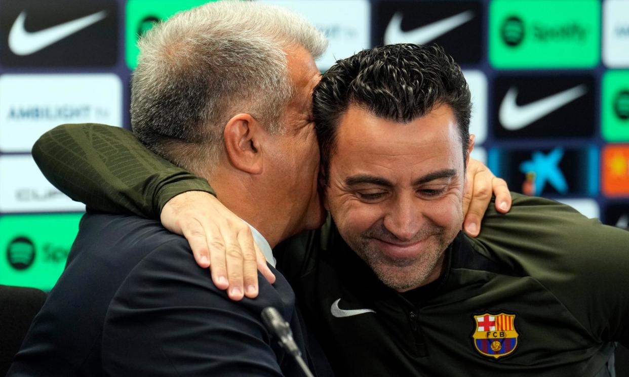 <span>Xavi is embraced by Barcelona’s president, Joan Laporta, who said: ‘I was always clear that I wanted him to continue.’</span><span>Photograph: Alejandro García/EPA</span>