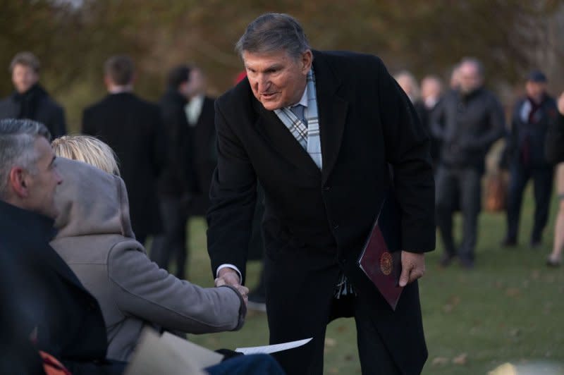 Sen. Joe Manchin, D-WV, greets guests Tuesday before the 2023 Capitol Christmas Tree lighting ceremony on the West Front Lawn of the U.S. Capitol in Washington, D.C. Photo by Bonnie Cash/UPI.