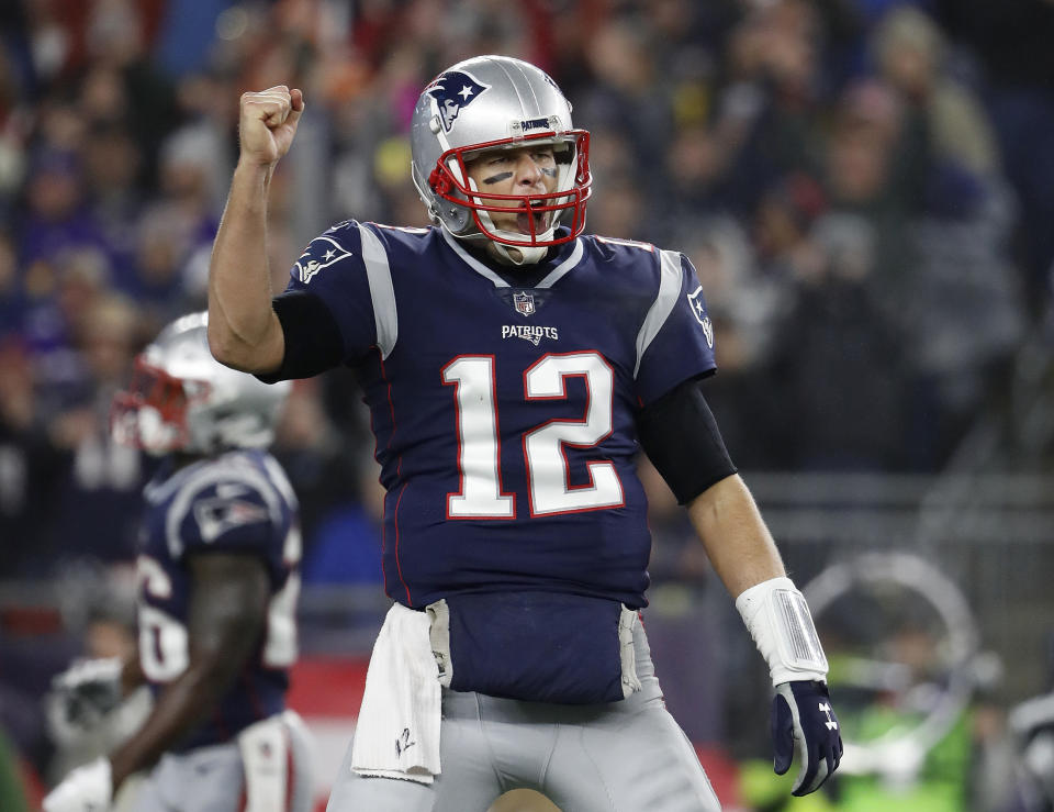 FILE - In this Sunday, Dec. 2, 2018, file photo, New England Patriots quarterback Tom Brady celebrates a touchdown during an NFL football game against the Minnesota Vikings at Gillette Stadium in Foxborough, Mass. Brady's next touchdown pass will move him past a couple of all-time greats. Brady is currently tied with Brett Favre for third place for the most regular-season TD passes with 508. Brady is also tied with Peyton Manning for the most ever combined in the regular season and playoffs with 579. (Winslow Townson/AP Images for Panini, FIle)