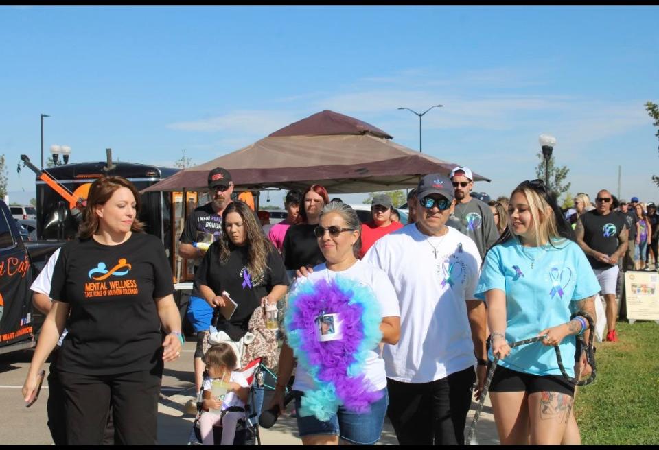 Pueblo residents walk through Lake Minnequa Veterans Memorial Park to remember loved ones during a Pueblo Suicide Memory Walk hosted by the Mental Wellness Task Force of Southern Colorado and the Suicide Prevention Coalition of Pueblo County on September 30, 2023.