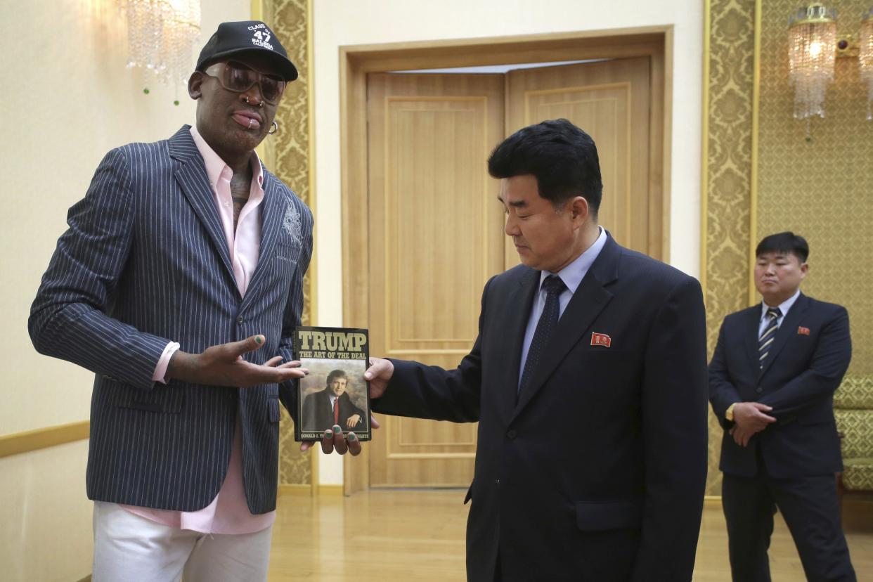 Former NBA basketball star Dennis Rodman presents a book titled 