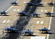 US F-15E Strike Eagles of the 4th Fighter Wing taxi down the runway during a Turkey Shoot training mission on Seymour Johnson Air Force Base on April 16, 2012. Bashar al-Assad's friends and foes headed for a showdown at the United Nations Wednesday, as Britain pushes for a resolution to pave the way for military strikes over suspected chemical attacks