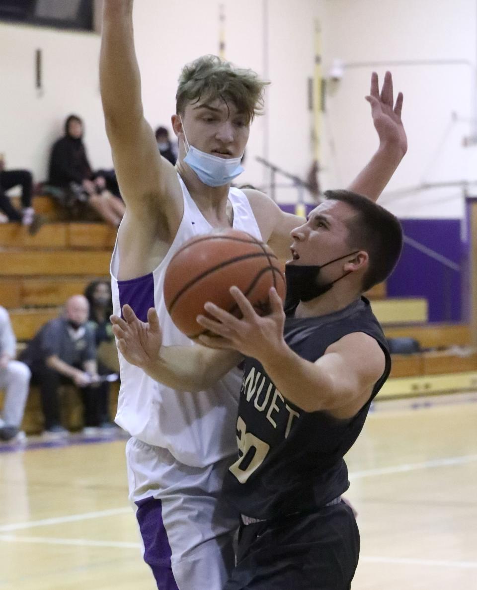 Clarkstown North's Joe Salerno pressures Nanuet's Jason Wain during their game at Clarkstown North Jan. 26, 2022. Nanuet won 52-43.