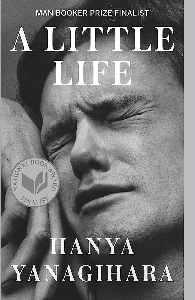 Book cover of "A Little Life" by Hanya Yanagihara showing a man's anguished face with text for awards received