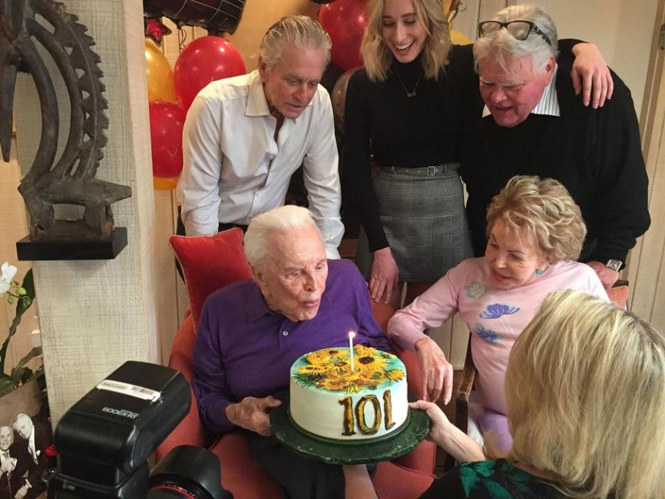 Kirk Douglas with son Michael, granddaughter Kelsey, son Joel and wife Anne.