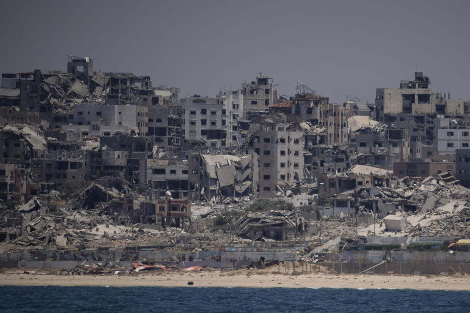 Destroyed buildings stand in the coast of the Gaza Strip as seen from the Mediterranean Sea, Tuesday, June 25, 2024. (AP Photo/Leo Correa)