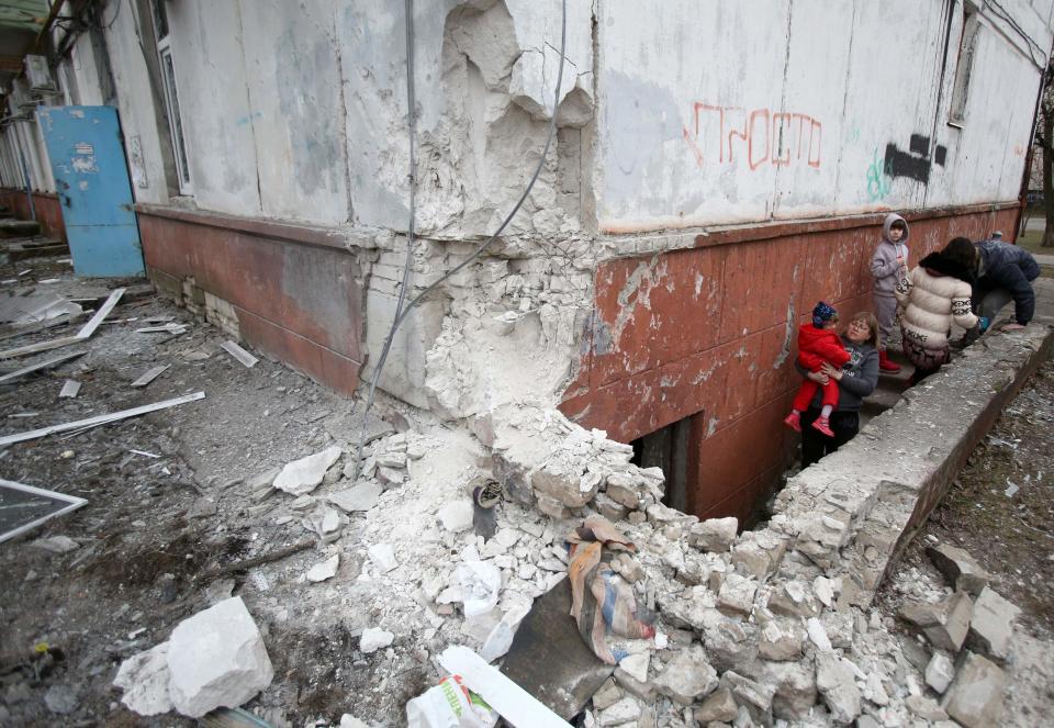 Residents of Sievierodonetsk, Lugansk Oblast, look out from the basement where they hid during heavy shelling by Russian forces and Russia-backed separatists on Feb. 28, 2022.