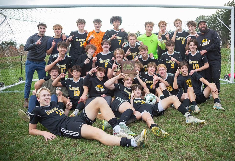Harwood poses after its double-overtime win over Rice during the D-II boys soccer championship game at Maxfield Sports Complex on Nov. 4, 2023.