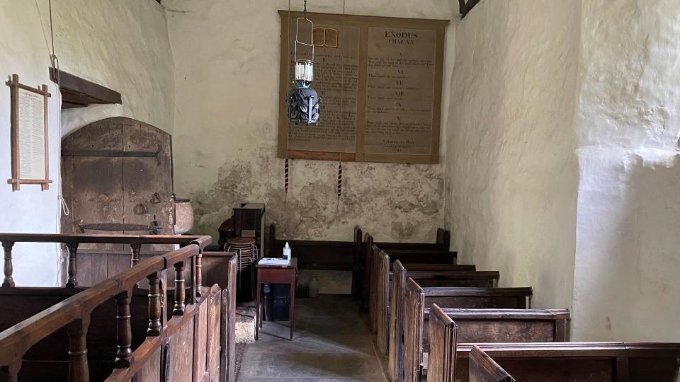 Inside of St Bueno's Church showing old pews