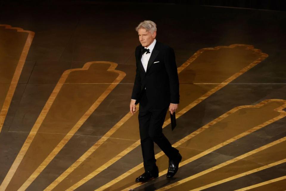 HOLLYWOOD, CALIFORNIA - MARCH 12: Harrison Ford walks onstage during the 95th Annual Academy Awards at Dolby Theatre on March 12, 2023 in Hollywood, California. (Photo by Kevin Winter/Getty Images)
