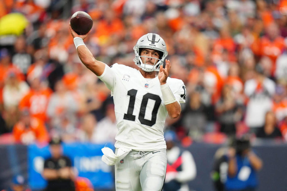Sep 10, 2023; Denver, Colorado, USA; Las Vegas Raiders quarterback Jimmy Garoppolo (10) passes the ball in the third quarter against the Denver Broncos at Empower Field at Mile High. Mandatory Credit: Ron Chenoy-USA TODAY Sports