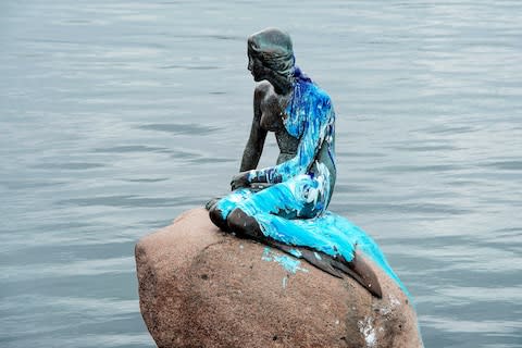 The Little Mermaid in Copenhagen is often attacked with paint - Credit: Getty