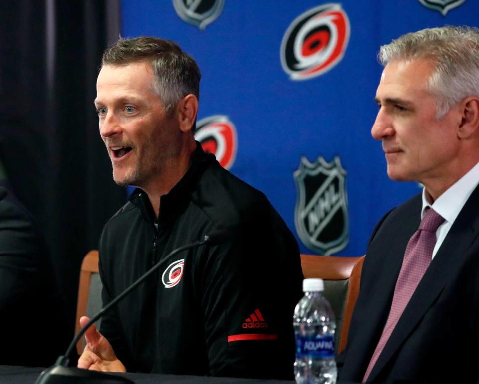 Hurricanes majority owner Thomas Dundon, left, and former general manager Ron Francis at a press conference where Dundon was announced as the buyer and new majority owner of the Carolina Hurricanes on Jan. 12, 2018. On Monday, Francis’ contract with the Canes was terminated, relieving him of all duties.