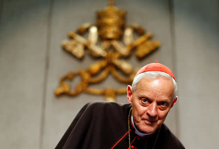 Cardinal Donald Wuerl, Archbishop of Washington, arrives during a news conference about the first session of the synod at the Vatican October 8, 2012. REUTERS/Alessandro Bianchi/Files