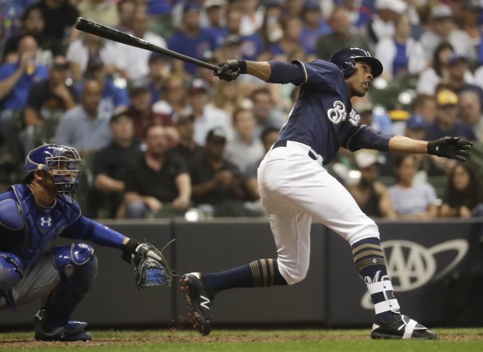 Milwaukee Brewers' Curtis Granderson hits a two-run home run during the seventh inning of a baseball game against the Chicago Cubs Wednesday, Sept. 5, 2018, in Milwaukee. (AP Photo/Morry Gash)