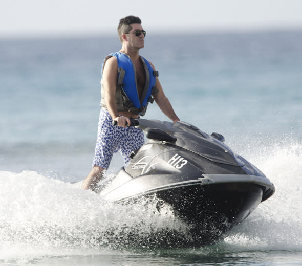 Simon Cowell is spotted on the beach in Barbados<P>Pictured: Simon Cowell <P><B>Ref: SPL672171  221213  </B><BR/>Picture by: Islandpaps / Splash News<BR/></P><P><B>Splash News and Pictures</B><BR/>Los Angeles:310-821-2666<BR/>New York:212-619-2666<BR/>London:870-934-2666<BR/>photodesk@splashnews.com<BR/></P>