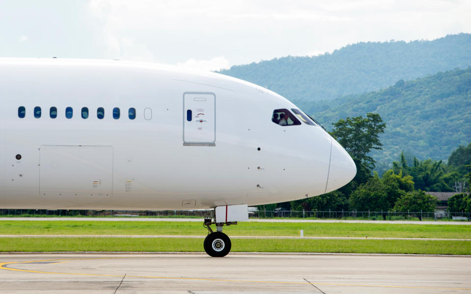 7. Sit toward the front of the plane