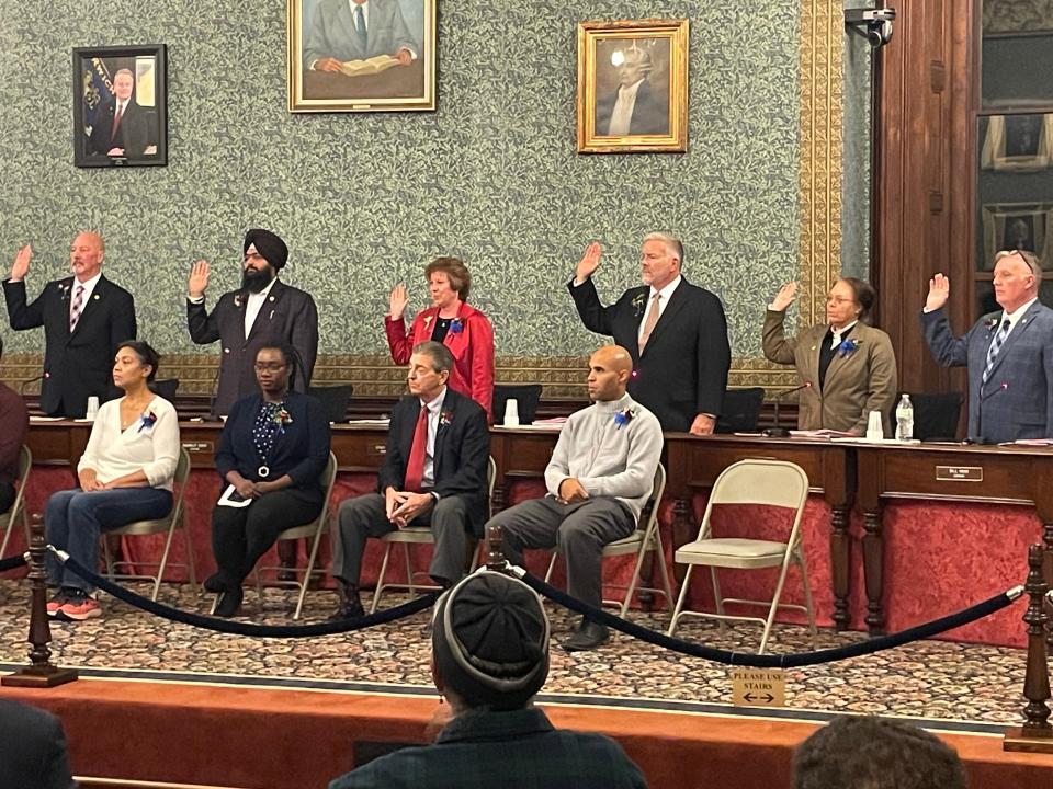 The Norwich City Council members standing while being sworn in Tuesday night.