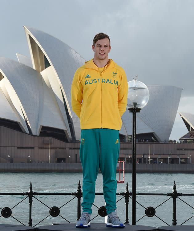 Kyle Chalmers wearing the Australian Olympic team competition and village uniform during the uniform unveiling in Sydney, Tuesday. Photo: AAP