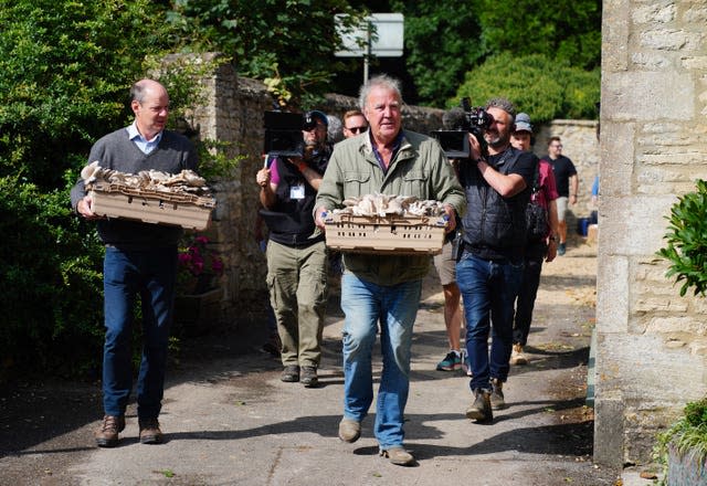 Jeremy Clarkson carrying a box of mushrooms